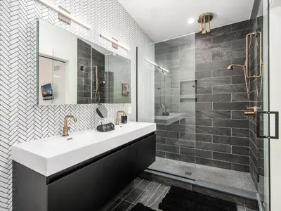 a bathroom with a sink and a shower at Historic German Village Industrial Masterpiece in Columbus