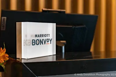 a book sitting on top of a computer monitor at TownePlace Suites by Marriott New Philadelphia in New Philadelphia
