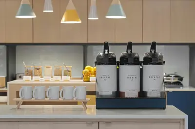 a group of four bottles of wine sitting on a counter at TownePlace Suites by Marriott New Philadelphia in New Philadelphia