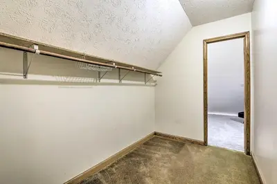 an empty room with a mirror and a door at Natures Haven Farmhouse in Pickerington with Deck in Pickerington
