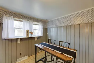 a room with a table and chairs and a window at 4-Bedroom Cincinnati Vacation Rental! in Cincinnati