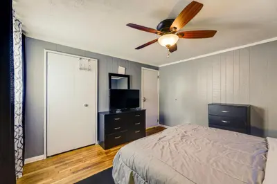 a bedroom with a bed and a ceiling fan at 4-Bedroom Cincinnati Vacation Rental! in Cincinnati