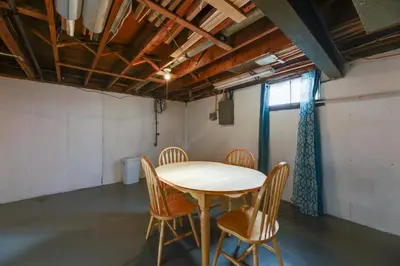 a room with a table and chairs in it at 4-Bedroom Cincinnati Vacation Rental! in Cincinnati