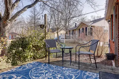 two chairs and a table on a porch at 4-Bedroom Cincinnati Vacation Rental! in Cincinnati