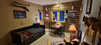 a bedroom with a bed and a table in it at House On Grass Runway with Fly-In/Fly-Out Access in Tecumseh
