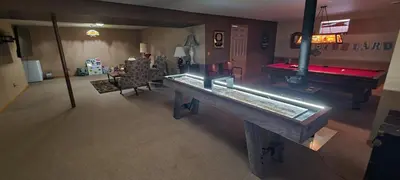 a living room with a ping pong table and a pool table at House On Grass Runway with Fly-In/Fly-Out Access in Tecumseh