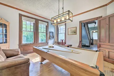 a living room with a pool table and a couch at NEW Grand Historic Home - 4 Mi to WEC! in Wilmington