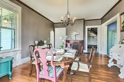 a dining room with a table and chairs at NEW Grand Historic Home - 4 Mi to WEC! in Wilmington