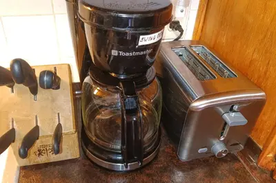 a blender sitting on a counter next to a toaster at Eastlake Home with Patio Less Than 1 Mi to Lake Erie! in Eastlake