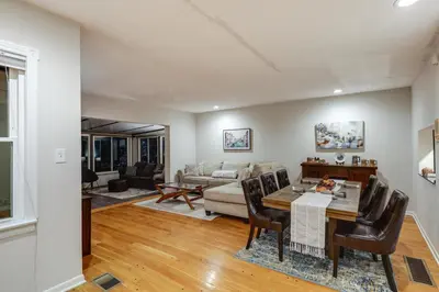 a living room with a table and chairs at Cincinnati Home, Patio with Downtown Views! in Cincinnati