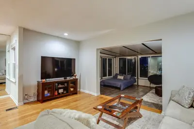 a living room with a couch and a tv at Cincinnati Home, Patio with Downtown Views! in Cincinnati