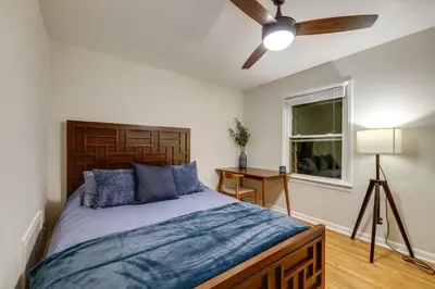 a bedroom with a bed and a ceiling fan at Cincinnati Home, Patio with Downtown Views! in Cincinnati