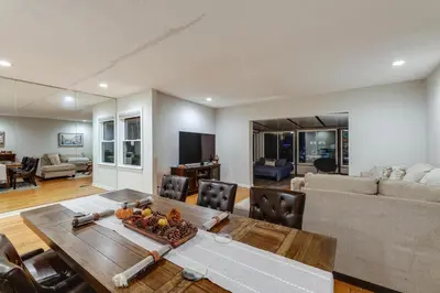 a living room with a table and a couch at Cincinnati Home, Patio with Downtown Views! in Cincinnati