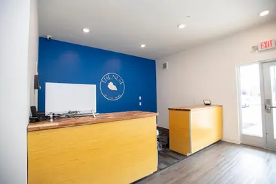an office with a blue wall and a desk at THE NEST in Greenfield