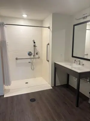 a bathroom with a shower and a sink at THE NEST in Greenfield