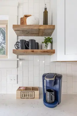 a coffee maker and a box on a kitchen counter at The Akron Retreat: Modern 3-Bedroom Oasis in Akron