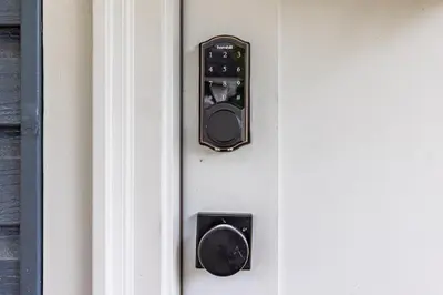 an open door with a door knob and a lock at The Akron Retreat: Modern 3-Bedroom Oasis in Akron