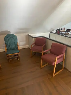 two chairs and a table in a room at Awesome Attic Studio Private Room 3A in Cincinnati