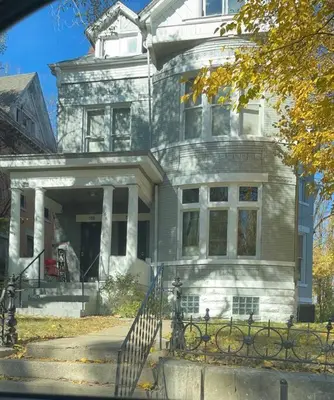 a large house with a staircase in front of it at Awesome Attic Studio Private Room 3A in Cincinnati