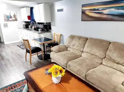 a living room with a couch and a table at Lovely Two Bedroom Home- Close to DT Greenfield in Greenfield
