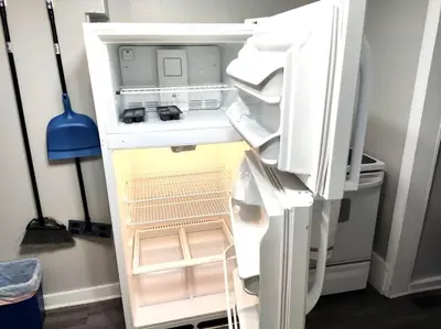 an empty refrigerator with its door open in a room at Lovely Two Bedroom Home- Close to DT Greenfield in Greenfield