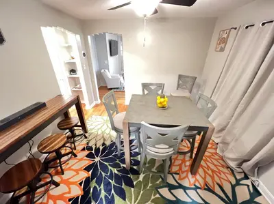 a dining room with a table and chairs at Comfy 2nd Floor Apartment in Quiet Neighborhood 13 Min to Dwntwn in Cincinnati