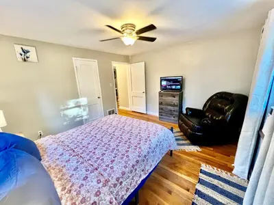 a bedroom with a bed and a ceiling fan at Comfy 2nd Floor Apartment in Quiet Neighborhood 13 Min to Dwntwn in Cincinnati