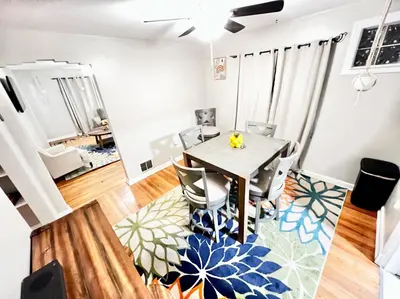a dining room with a table and chairs at Comfy 2nd Floor Apartment in Quiet Neighborhood 13 Min to Dwntwn in Cincinnati