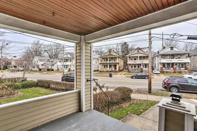 a screened porch with a view of a street at Lakewood Home with Yard about 8 Mi to Cleveland! in Lakewood