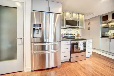 a kitchen with a large stainless steel refrigerator at Waterfront Cleveland Apt about 1 Mi to Downtown in Cleveland