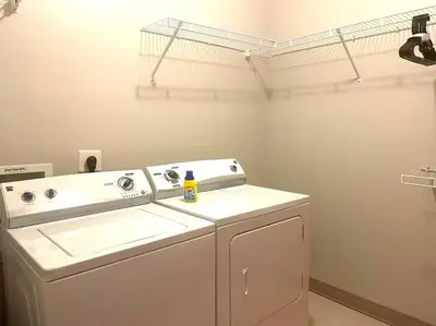 a washer and dryer in a laundry room at King Size with OSU Theme! in Columbus