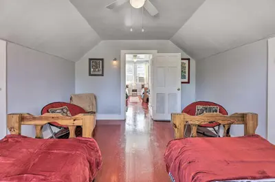 a bedroom with two beds and a ceiling at Manchester Getaway on Ohio River Scenic Byway in Manchester