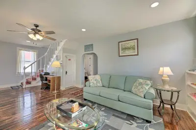a living room with a couch and a glass table at Manchester Getaway on Ohio River Scenic Byway in Manchester