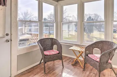 two chairs and a table in a room with windows at Manchester Getaway on Ohio River Scenic Byway in Manchester