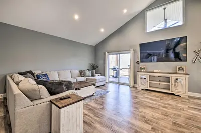 a living room with a couch and a tv at Waterfront Home on Lake Milton Dock, Hot Tub in Lake Milton