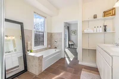 a bathroom with a tub and a sink at Downtown Views-Prime Location! in Cincinnati
