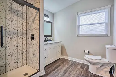 a bathroom with a shower with a toilet and a sink at German Village Getaway with Grill 4 Mi to OSU! in Columbus