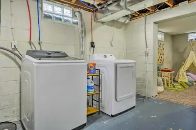 a laundry room with a washer and a dryer at German Village Getaway with Grill 4 Mi to OSU! in Columbus