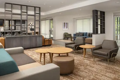 a lobby with couches and chairs and tables at TownePlace Suites by Marriott Cincinnati Mason in Mason