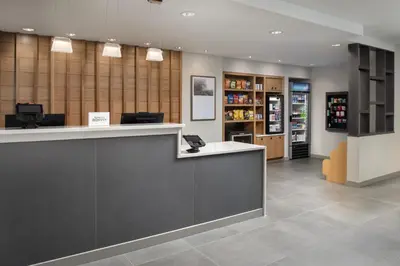 a lobby of a pharmacy with a reception counter at TownePlace Suites by Marriott Cincinnati Mason in Mason