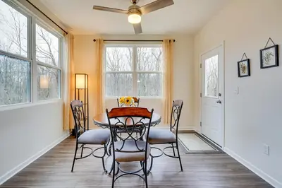 a dining room with a table and chairs at Private Backyard! Spacious Home 25 Mi to Columbus in New Albany