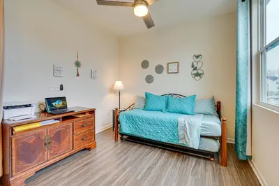 a bedroom with a bed and a desk with a television at Private Backyard! Spacious Home 25 Mi to Columbus in New Albany