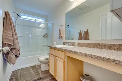 a bathroom with a sink and a toilet and a shower at Private Backyard! Spacious Home 25 Mi to Columbus in New Albany