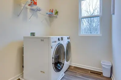 a washing machine in a laundry room with a window at Private Backyard! Spacious Home 25 Mi to Columbus in New Albany