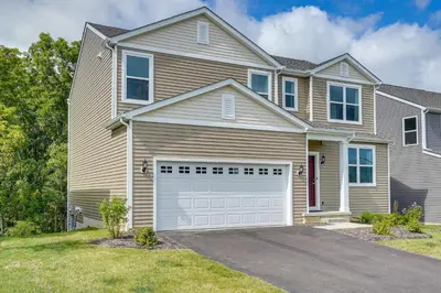 a house with a garage in front of it at Private Backyard! Spacious Home 25 Mi to Columbus in New Albany