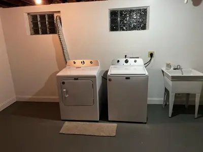 two ovens and a sink in a room at Sunny Stay Bright and Cozy Suite 1 in Cincinnati