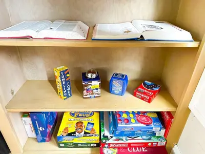 a shelf with some food and books on it at IvyLand Pines in Cleveland Heights