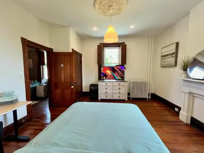 a bedroom with a large bed in a room at Skyline Retreat Spacious Elegance Queen Suite 2 City Views in Cincinnati