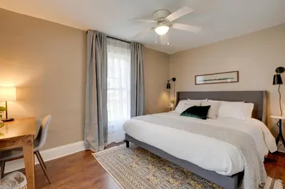 a bedroom with a bed and a desk and a window at Gambier Vacation Rental about 5 Mi to Mt Vernon! in Gambier
