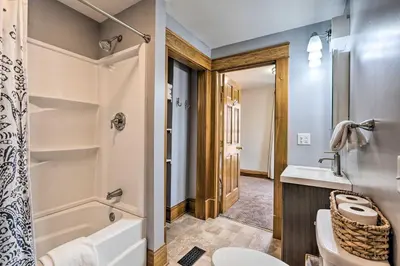 a bathroom with a tub and a toilet and a sink at Gambier Vacation Rental about 5 Mi to Mt Vernon! in Gambier